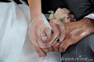 Just Married Interracial Couple Holding Hands Wearing Wedding Rings Stock Photo