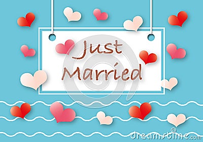 Just married with white card and colour heart on pastel blue background, wedding day,. Stock Photo