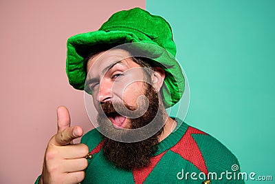 Just perfect. St Patricks day. Hipster with beard wearing green party costume pointing. Cheerful man celebrate holiday Stock Photo