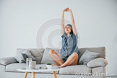 Just waked up. Young woman is at home. Conception of beauty Stock Photo