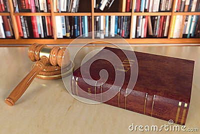 Justice books with wooden judges gavel on table in a courtroom or enforcement office Law concept. 3d rendering Stock Photo