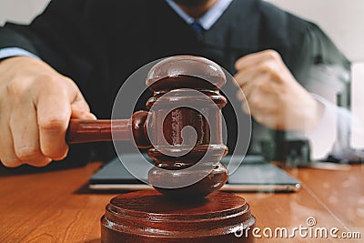 justice and law concept.Male judge in a courtroom with the gavel Stock Photo