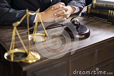 Justice and law concept.Male judge in a courtroom working on wood table with documents., attorney court judge justice gavel legal Stock Photo