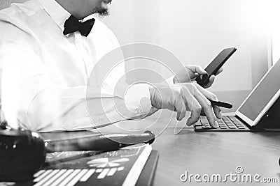 Justice and Law context.Male lawyer hand working with smart phone,digital tablet computer docking keyboard with gavel and Stock Photo