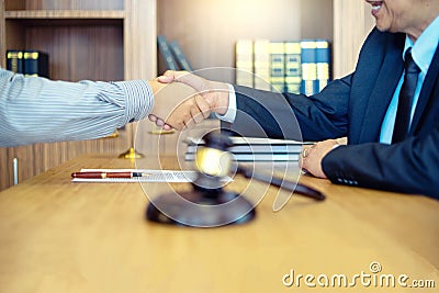 Justice lawyers Handshake to businessman or client Stock Photo