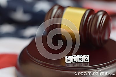 Justice mallet and FLSA acronym. Fair labor standarts act Stock Photo