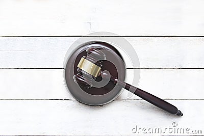 Justice mallet on a white wooden desk in a courtroom during a judicial trial. Law concept and empty copy space Stock Photo