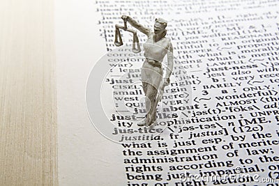 Justice Statue with Definition Stock Photo