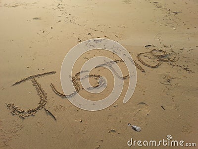 Justice written on beach sand. Stock Photo
