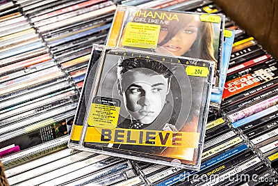 Justin Bieber CD album Believe 2012 on display for sale, famous Canadian singer and songwriter Editorial Stock Photo