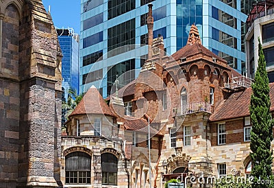 Juxapositon of old and new buildings - St Martins House, a beautful and ornate former hospital and memorial for veterans stands ag Editorial Stock Photo