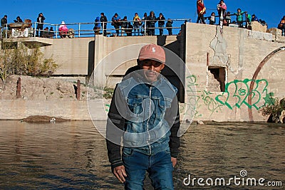 Young migrants crossing the border Editorial Stock Photo