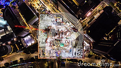 4K hyperlapse time-lapse of under construction site, crane, and car traffic transportation at night in city. Drone aerial top. 4K hyperlapse time-lapse of under stock footage 4K hyperlapse time-lapse of under construction site, crane, and car traffic transportation at night in city. Drone aerial top. 4K hyperlapse time-lapse of under stock footage