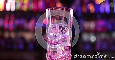 Professional male bartender pouring mixed blue liquor cocktail drink Stock Photo