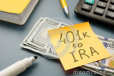 401k to IRA rollover words on the memo stick. Stock Photo