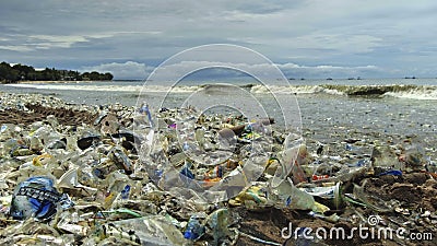 4K video of plastic garbage and other trash on sea beach. Ecological concept Editorial Stock Photo