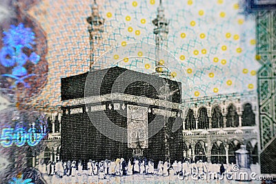 Kaaba and Al-masjid Al-haram in Mecca photo on the observe side of 500 Saudi riyals banknote, close-up with selective focus Editorial Stock Photo