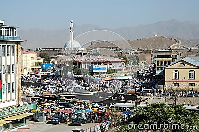 A view of central Kabul, Afghanistan showing the market, mosque, crowds of people and distant hills. Editorial Stock Photo