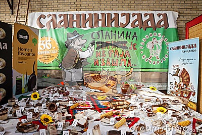 KACAREVO, SERBIA - FEBRUARY 18, 2023: Selective blur on a Stand showing cured meat in the contest of Slaninijada Kacarevo market, Editorial Stock Photo