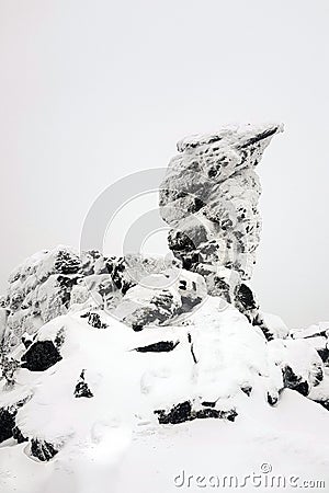 Kachkanar mountain, Ural, Russia. Camel rock covered in snow. Vertical orientation Stock Photo