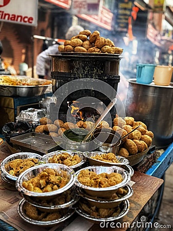 Kachori an Indian snack served with onion and green chatni and red chatani Stock Photo