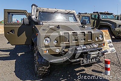 Special multi-purposes armored vehicle Rys, Iveco LMV. Close-up view of the headlight, grille and winch Editorial Stock Photo