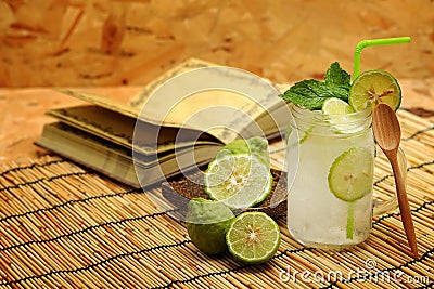 Kaffir lime So, Bergamot soda Cool drink, Thailand tradition Herb for Treatment of Acid Reflux, with Oriental Earth tone map backg Stock Photo