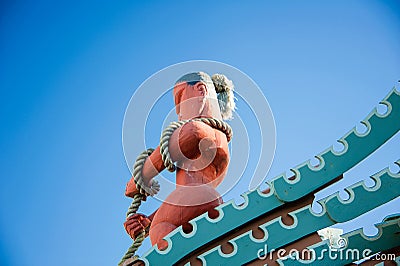 Kaikoura, Canterbury, New Zealand. Maori totem figure of mythical figure Maui, fishing from his canoe Editorial Stock Photo