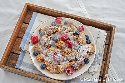 Kaiserschmarrn - traditional austrian pancake dessert with fresh fruit Stock Photo