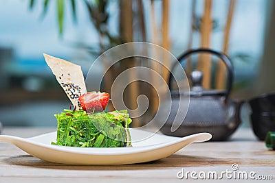 Kaiso salad on a plate with peanut sauce Stock Photo