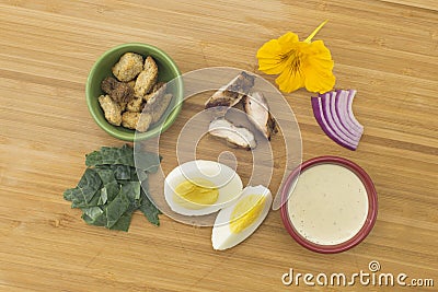 Kale Caesar Salad with Chicken & Edible Flower Stock Photo