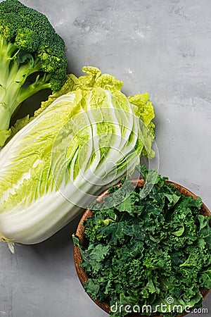 Kale, chinese cabbage, broccoli on a gray background. Top view, copy space for text, selective focus Stock Photo