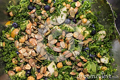 Kale salad in silver salad bowl full frame Stock Photo