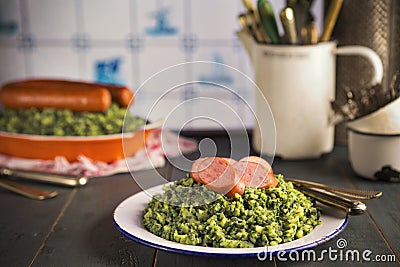 Kale with smoked sausage or Boerenkool met worst Stock Photo