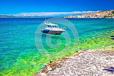 Kali beach and boat on turquoise sea Stock Photo