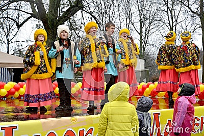 KALININGRAD, RUSSIA. Actors of youth Russian national folklore ensemble sings the song on Maslenitsa holiday Editorial Stock Photo