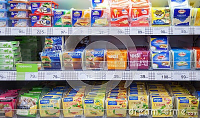 Processed cheese on shelves of supermarket Editorial Stock Photo