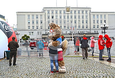 KALININGRAD, RUSSIA. A mascot of the FIFA World Cup of FIFA 2018 Zabivaka wolf embraces the girl Editorial Stock Photo