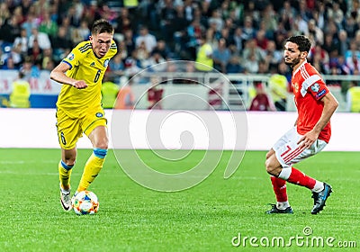 Kazakhstan national football team defender Aibol Abiken against Russia midfielder Magomed Ozdoyev Editorial Stock Photo