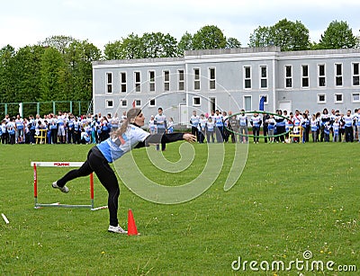 KALININGRAD, RUSSIA. The young woman has thrown at the competitions Cheerful Starts a Editorial Stock Photo