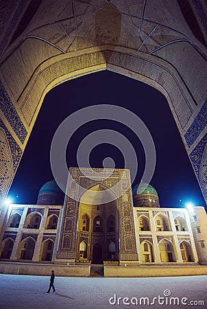 Kalon Mosque, Mir-i Arab Madrasah square, Historic ancient building ruin at night, Bukhara, Uzbekistan Editorial Stock Photo