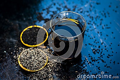 Kalonji with grape juice and powder of kalonji. Stock Photo