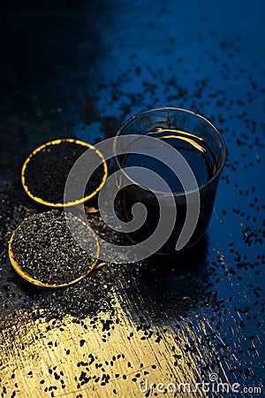 Kalonji with grape juice and powder of kalonji. Stock Photo