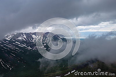 Melting snow in June on the Kamchatka Peninsula. Russia Stock Photo