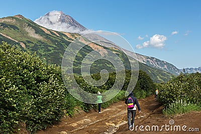 Group of tourists walks along the Viluchinsky pass Editorial Stock Photo