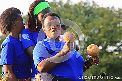 African singer sings and dances at a street event in Kampala Editorial Stock Photo