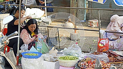 Kampot, cambodia - circa january 2024:busy market scene on the local food market Editorial Stock Photo