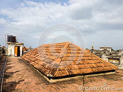 Triangular tiled roof on the terrace of an old heritage building in a village in Stock Photo