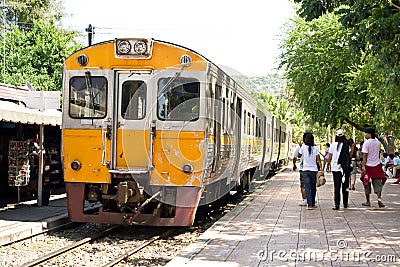 Yellow Diesel train on track at a platform. Editorial Stock Photo