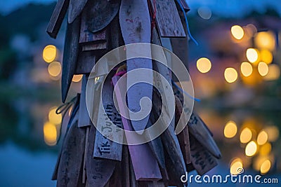 Prayer tags tied on the bridge in the Pilok mine village in kanchanaburi City Thailand Stock Photo